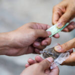 Drug addict buying narcotics and paying,Drug trafficking